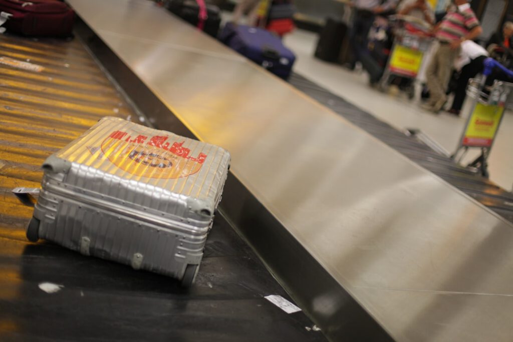 Suitcase on a baggage claim conveyor belt at Frankfurt Airport